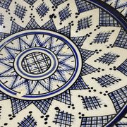 Moroccan dish in handcrafted sculpted ceramic, blue geometric patterns and