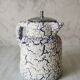 Cracked and enamelled ceramic teapot