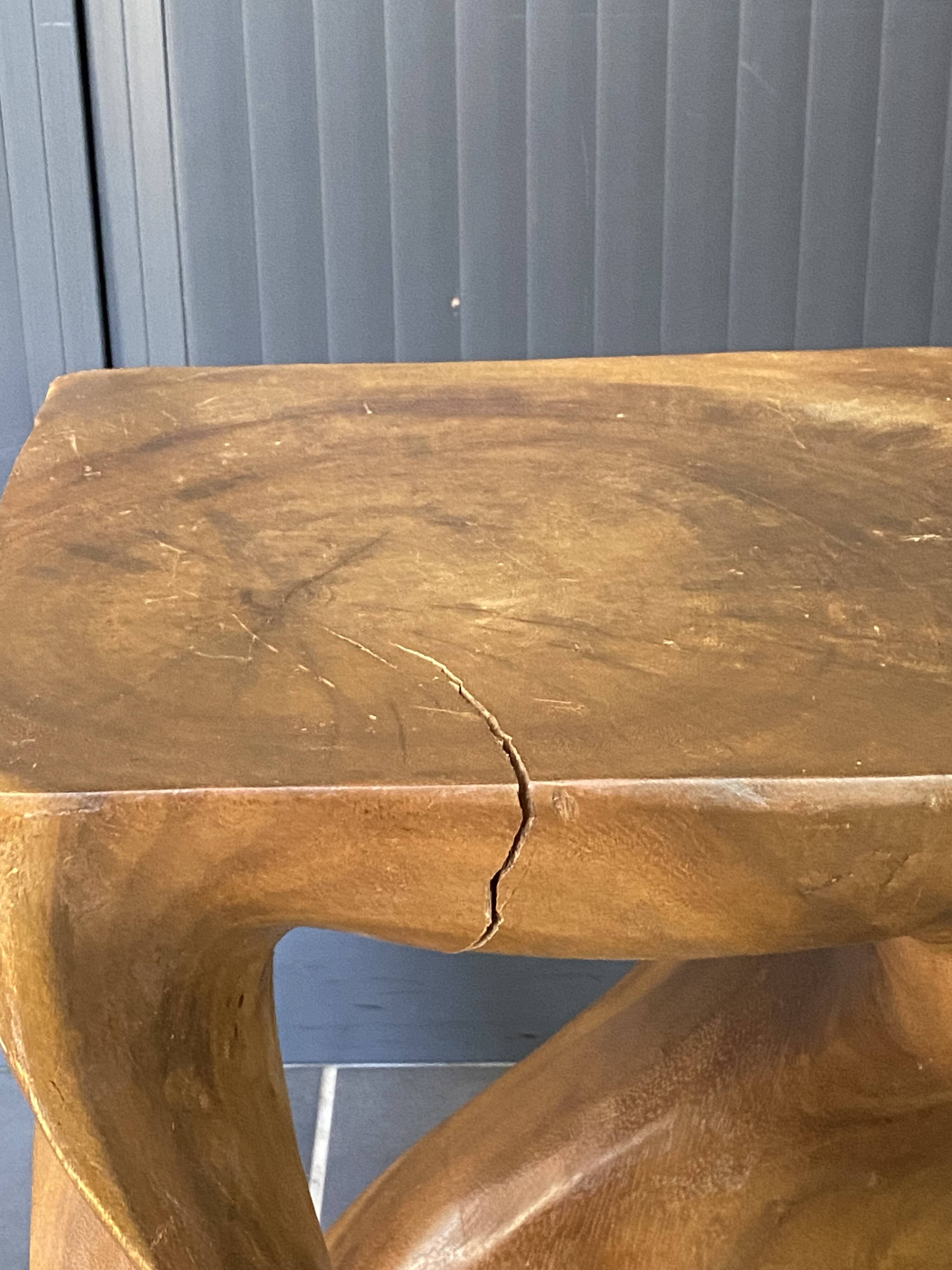 Stool no. 1 in solid raw walnut wood, carved from the mass, 1970.