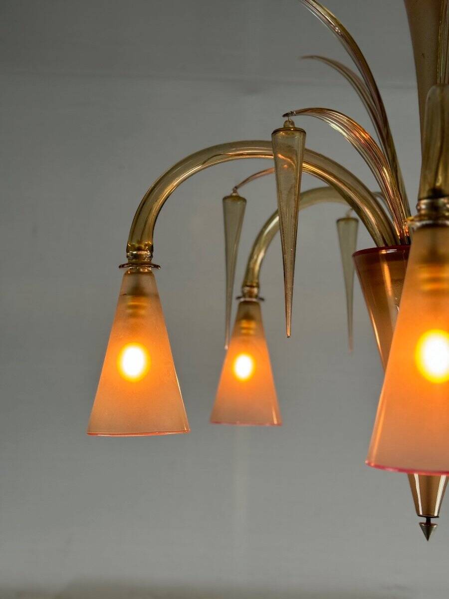 Venetian chandelier in beige/gray murano glass bordered with a red net