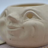 Cache pot visage