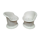 Pair of white plastic armchairs