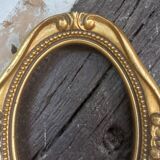Stylized oval gold frame
