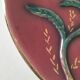 Large antique plate in floral slip with hand-painted relief decoration