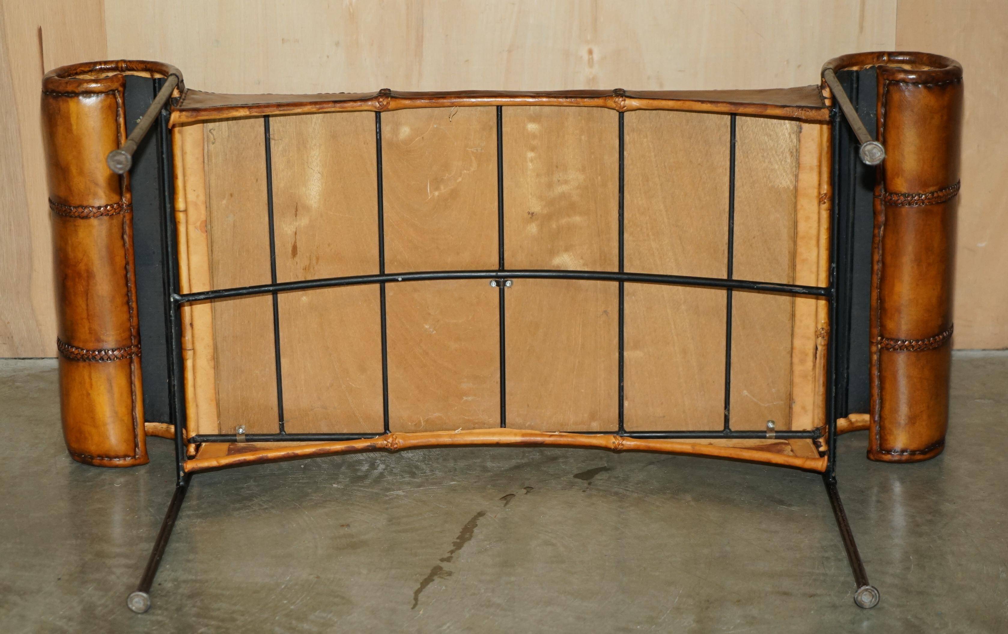 Vintage Spanish window bench in hand-stitched leather and restored iron.
