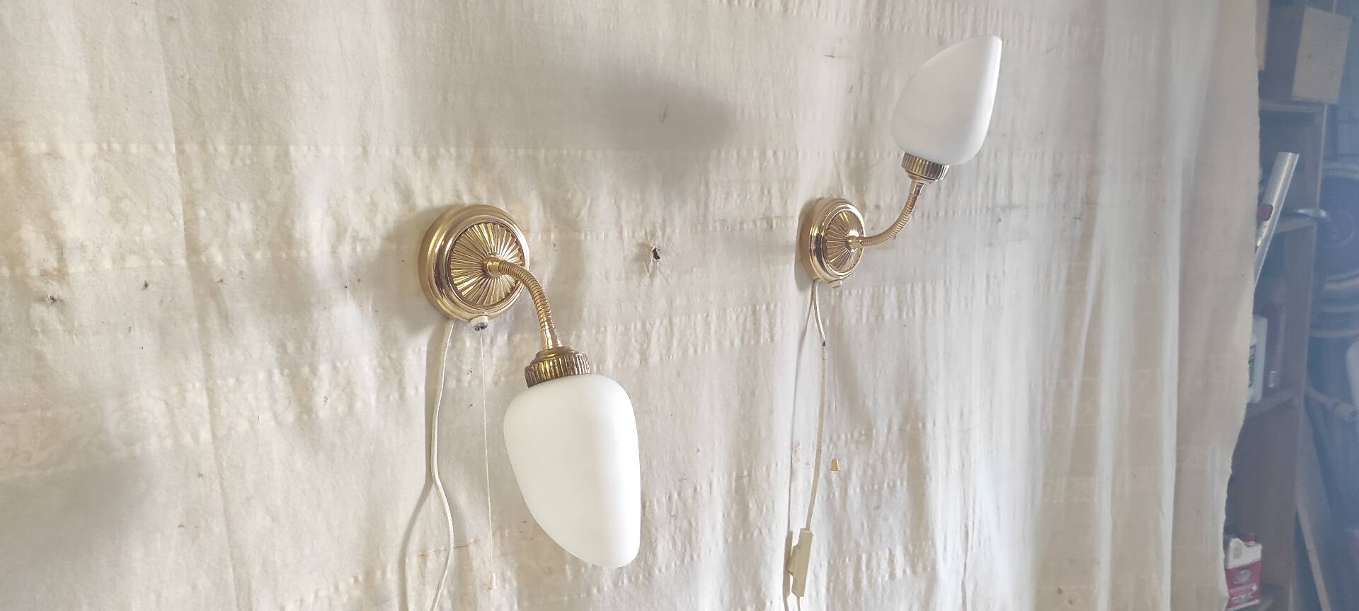 Articulated brass and opaline wall lights - mid 20th century.