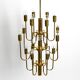 Three staged 18 arm Mid Century brass chandelier with a long brass rod