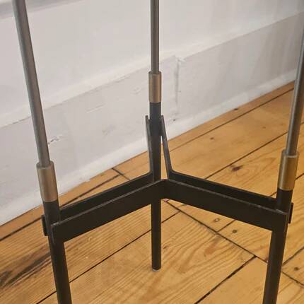 Vintage tripod metal side table with a blue brass bowl.