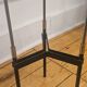 Vintage tripod metal side table with a blue brass bowl.