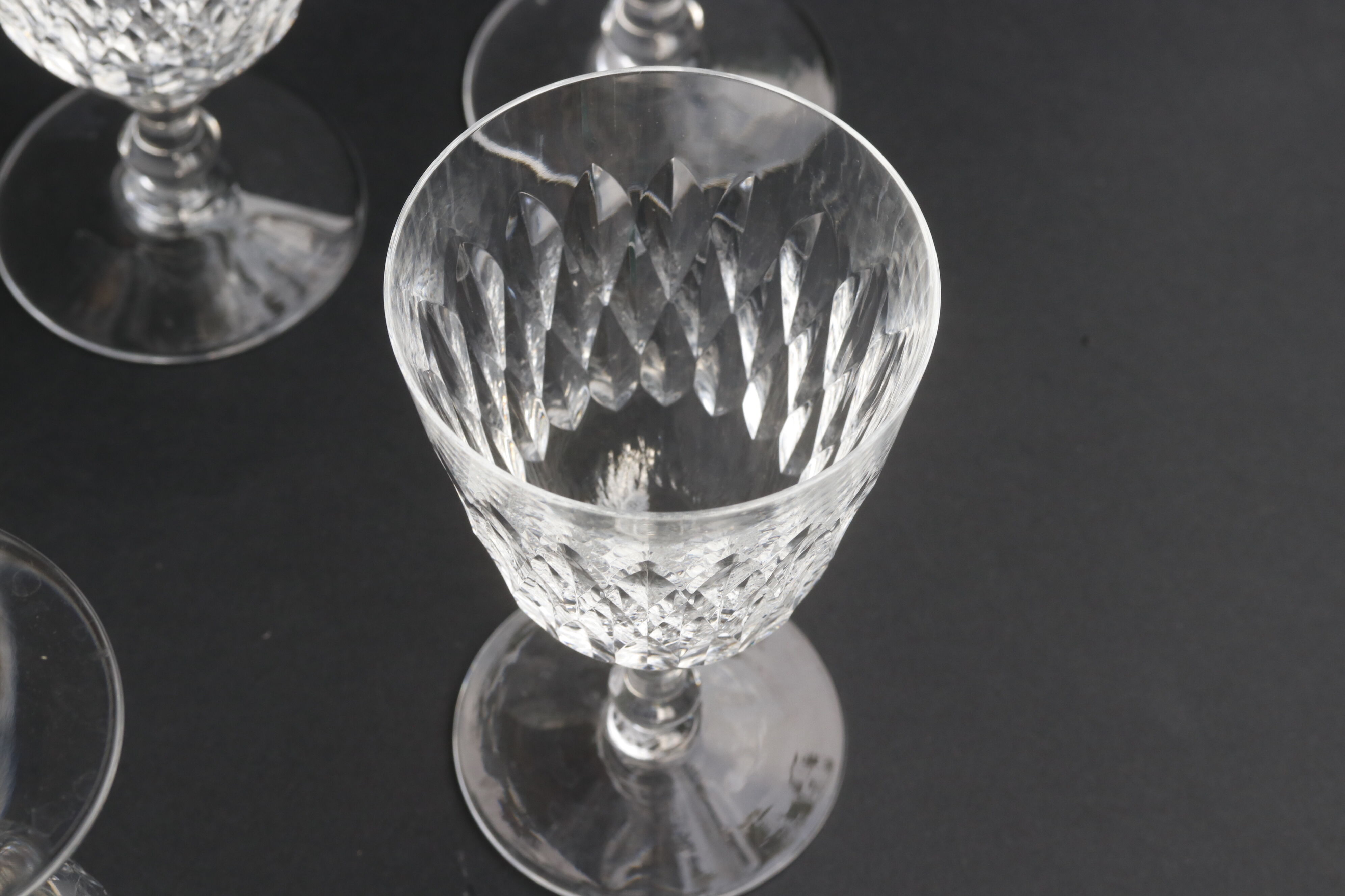 Suite of 6 Baccarat crystal water glasses with honeycomb patterns.