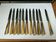 Set of 12 large knives and 11 horn and steel dessert knives