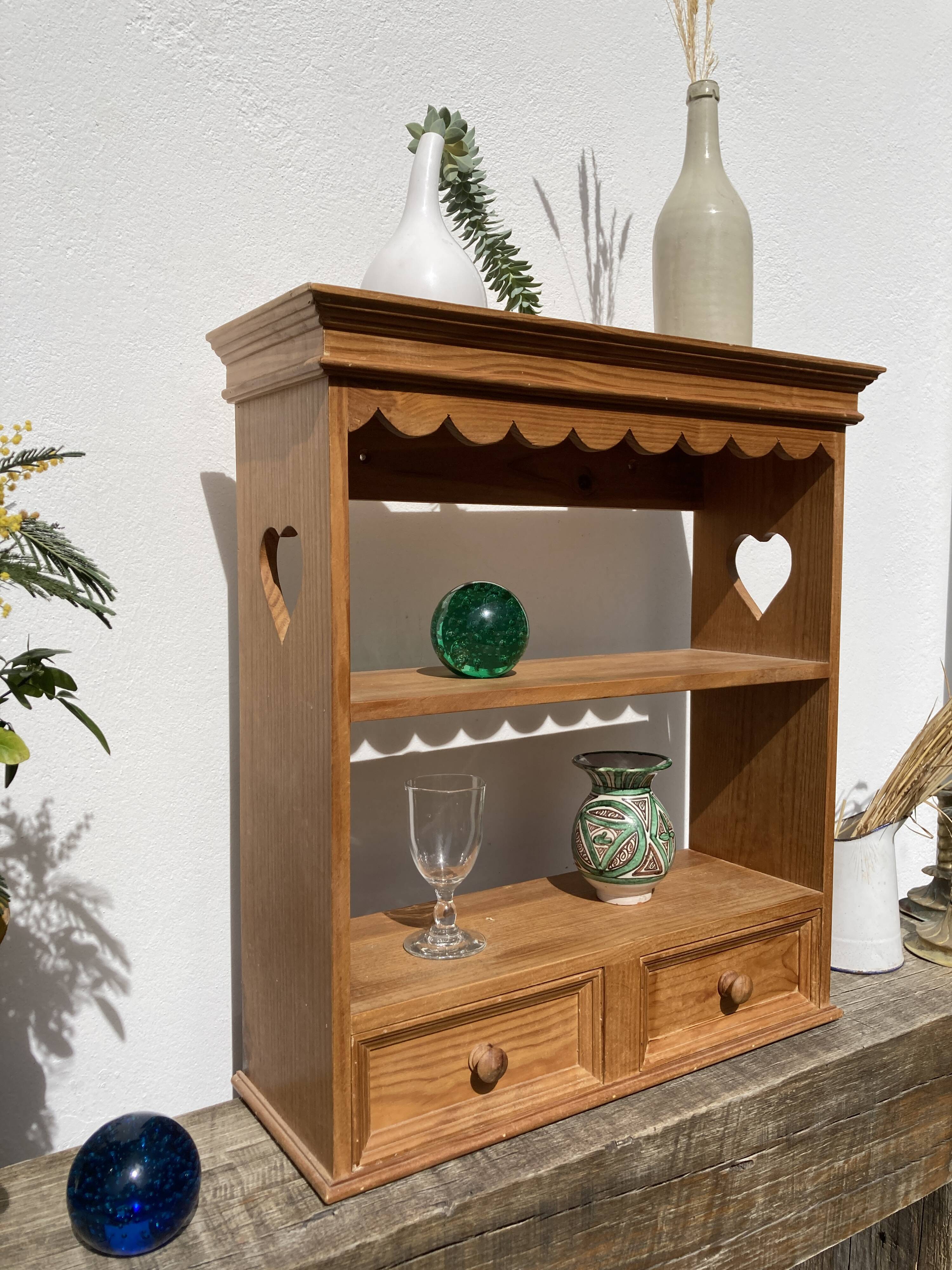 Wall shelf in raw wood with drawers and openwork hearts
