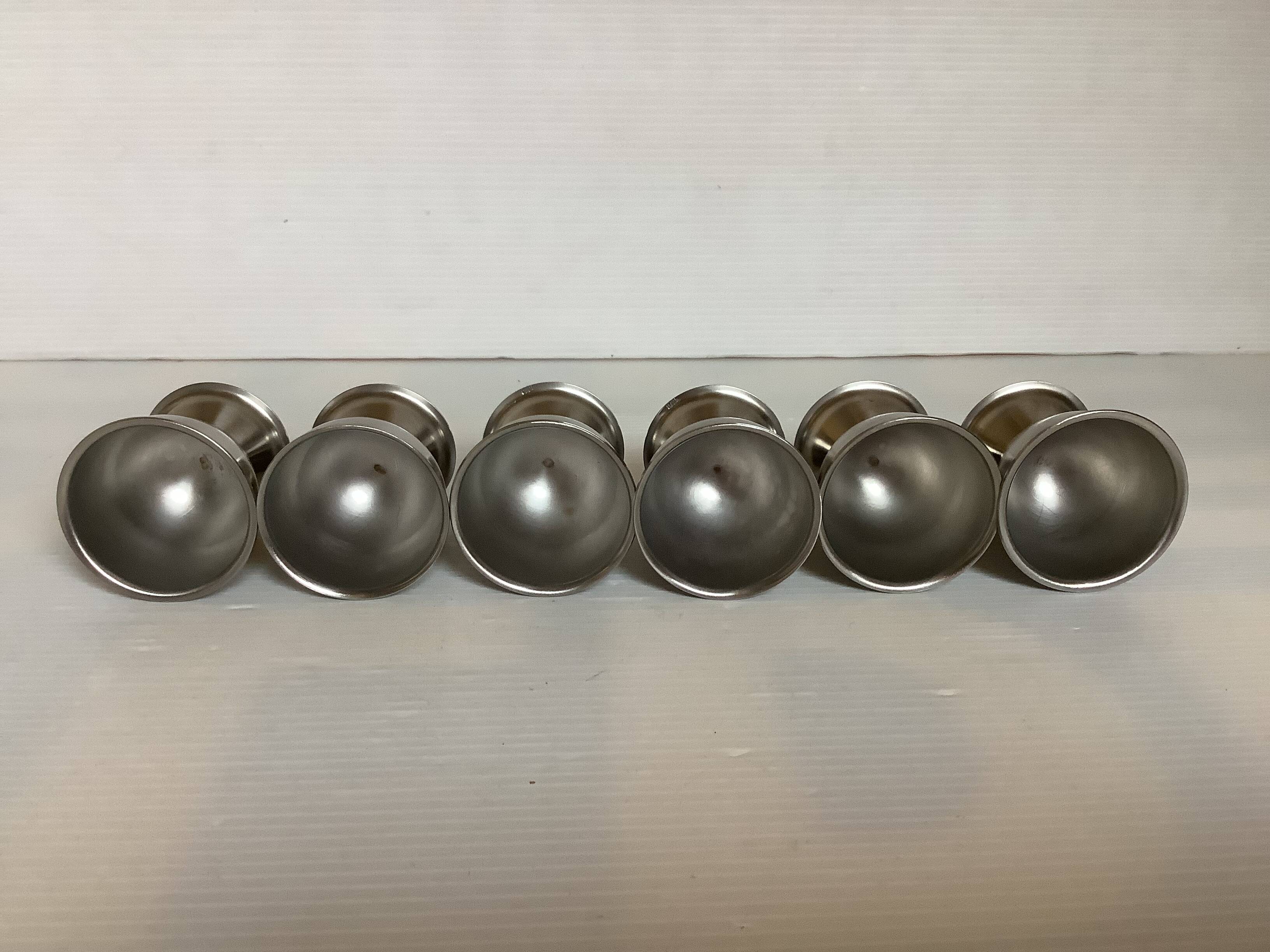 Six metal egg cups