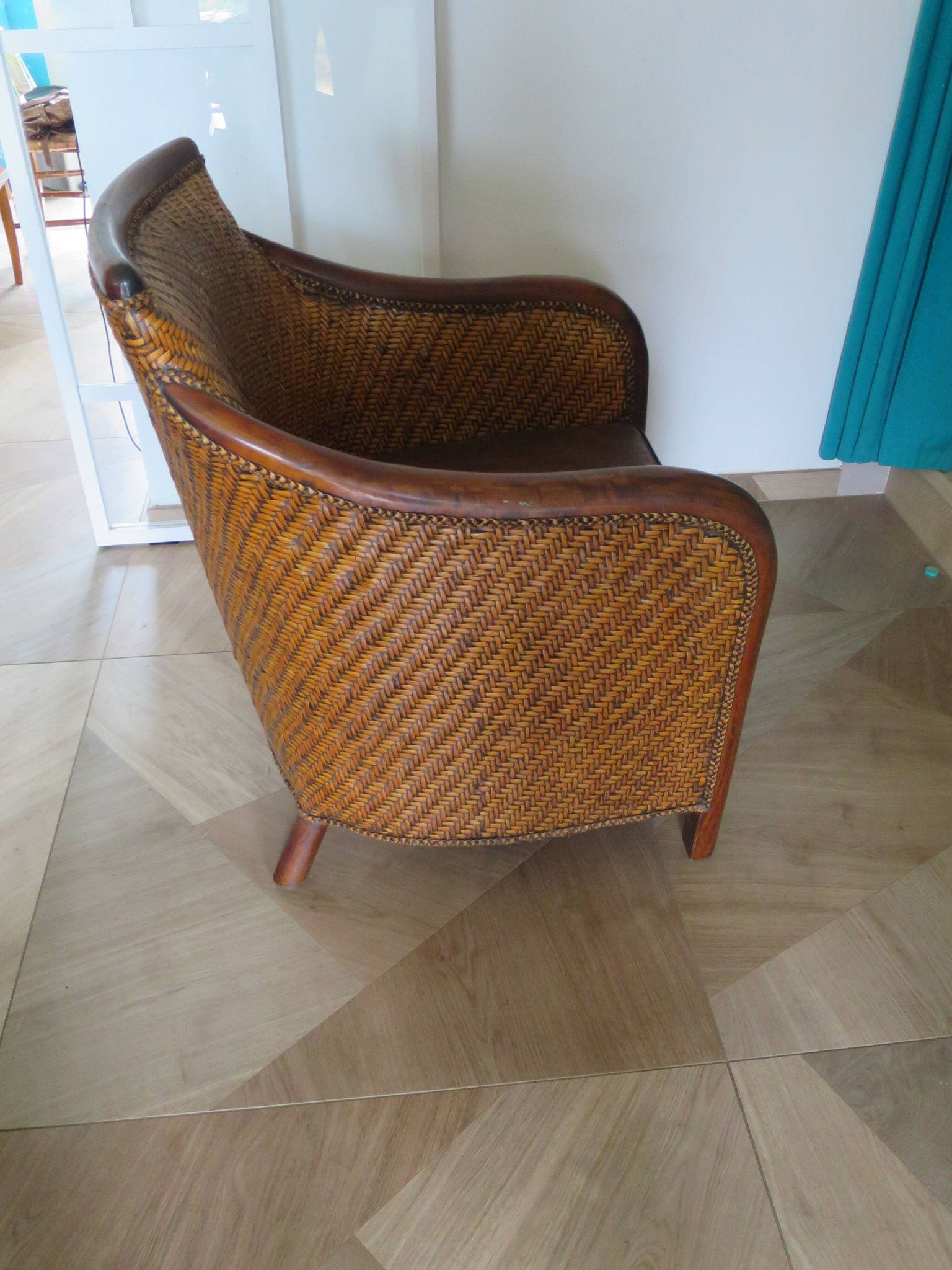 Woven rattan armchair and exotic wood in colonial style, 1980s.