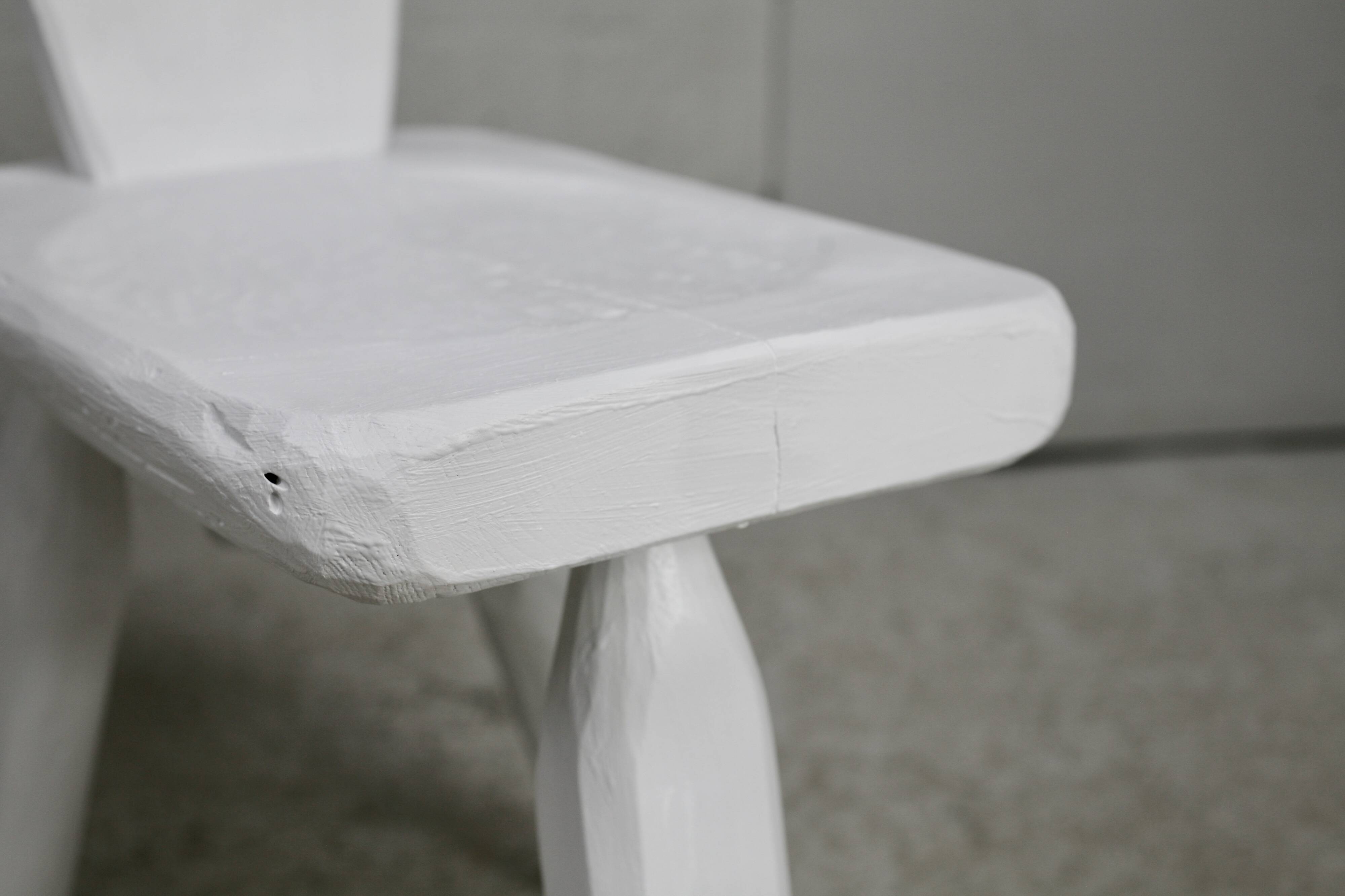 Pair of tripod chairs, gouged seats. Brutalist, circa 1960. Painted wood.