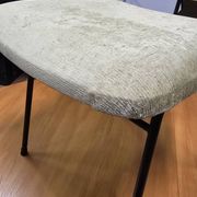Vintage 1950s chair in black metal and almond green fabric.