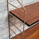 Shelf 1950 has 70 gold uprights and and plating shelf with black plastic border,