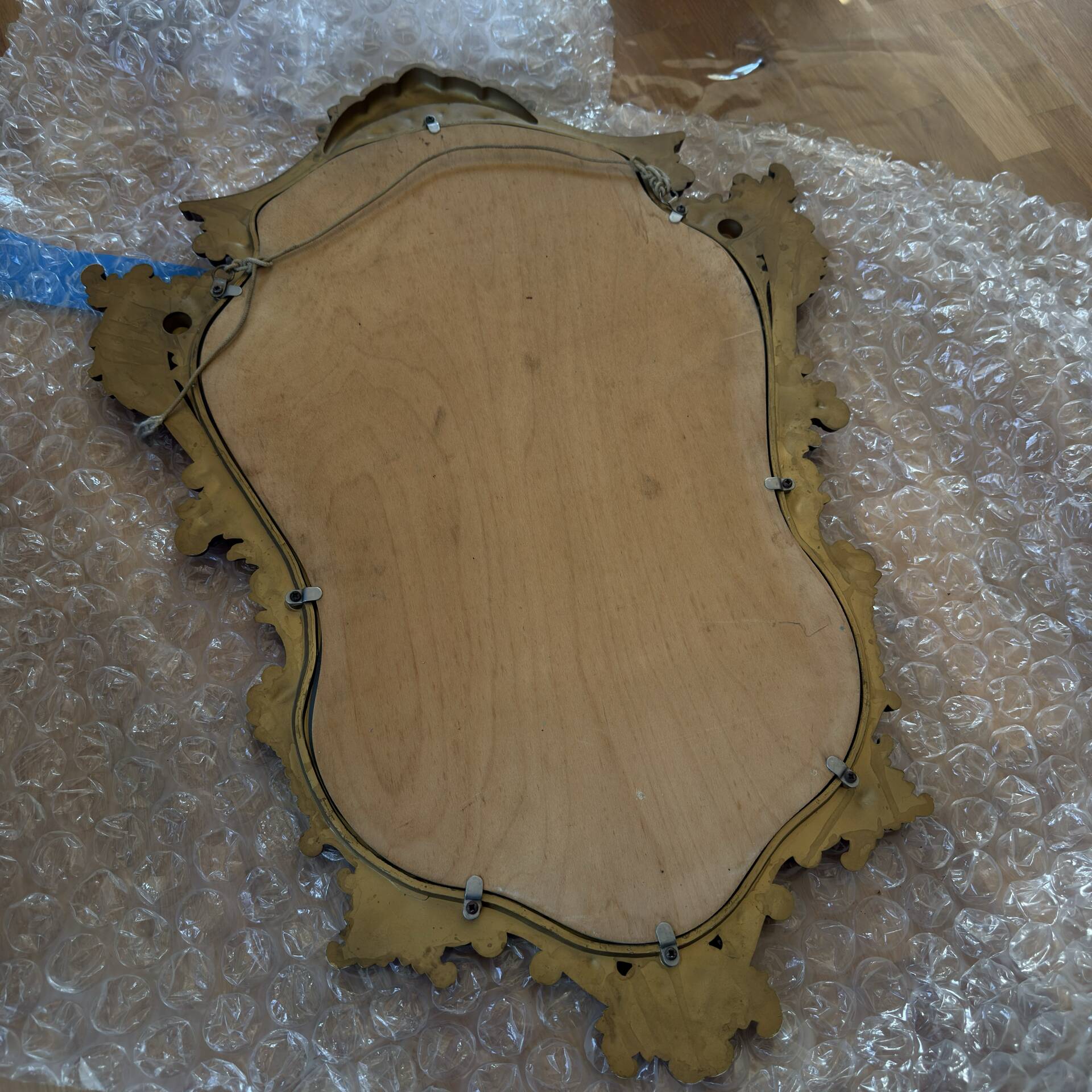 Antique mirror in Louis XV Rocaille style with carved frame.