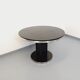 Vintage dining table in melamine with a black wood effect and chrome metal.
