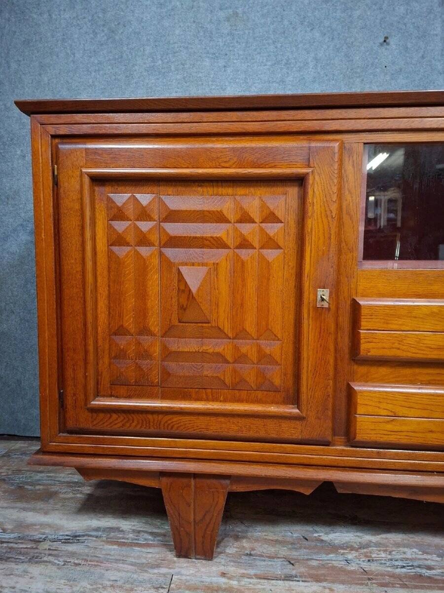 Low buffet in carved oak, Art Deco style, circa 1930.
