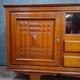 Low buffet in carved oak, Art Deco style, circa 1930.