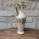 Antique amphora-shaped vase with Roman or Greek decoration