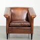 Sleek sheepskin Art Deco design armchair with black piping