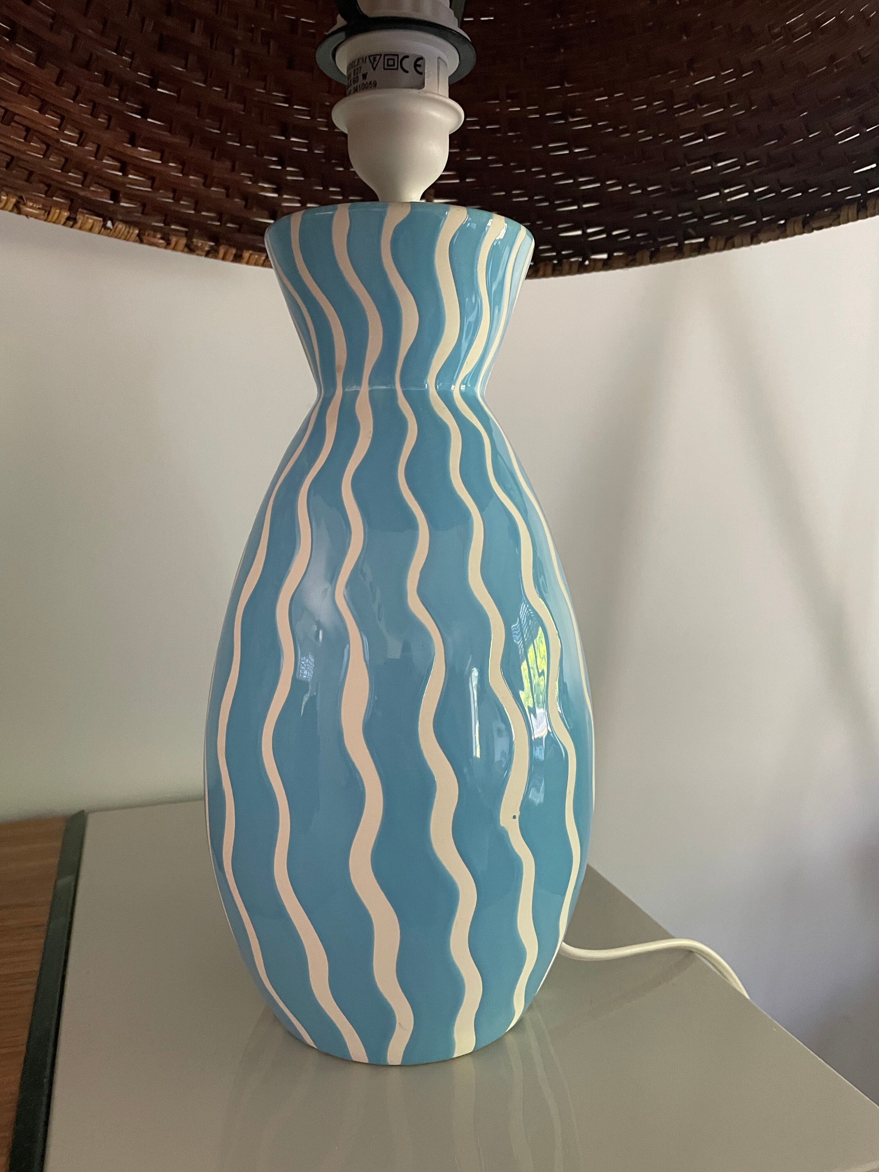 Blue ceramic lamp and rattan