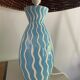 Blue ceramic lamp and rattan