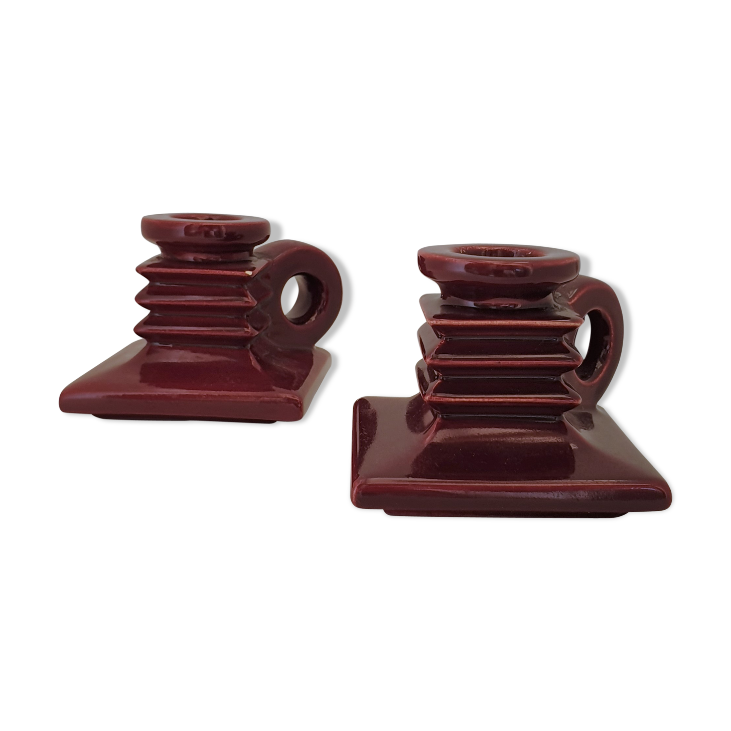 Pair of art deco candlesticks in bordeaux ceramics