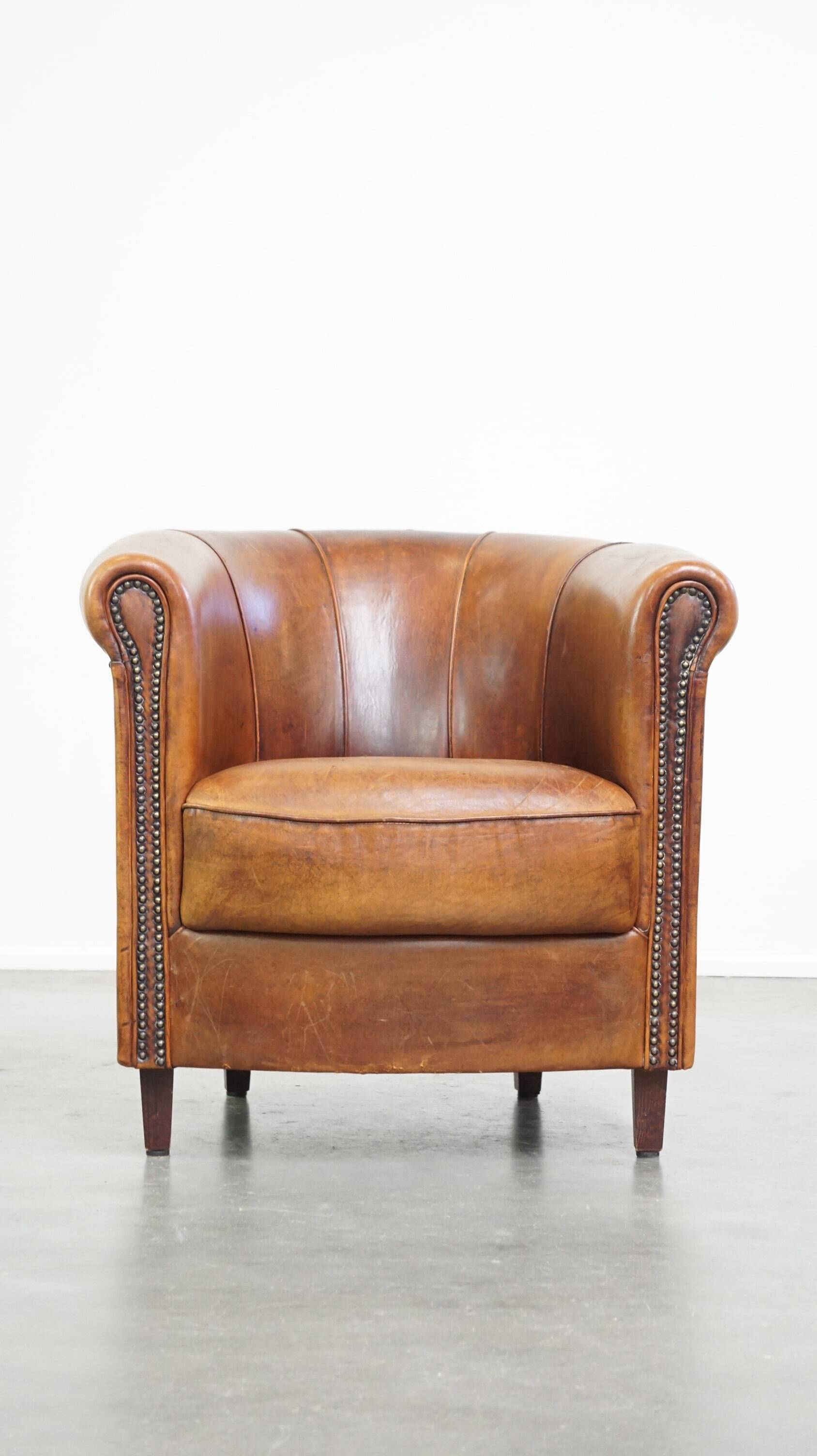 Brown leather club chair
