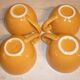 4 yellow and orange ceramic cups