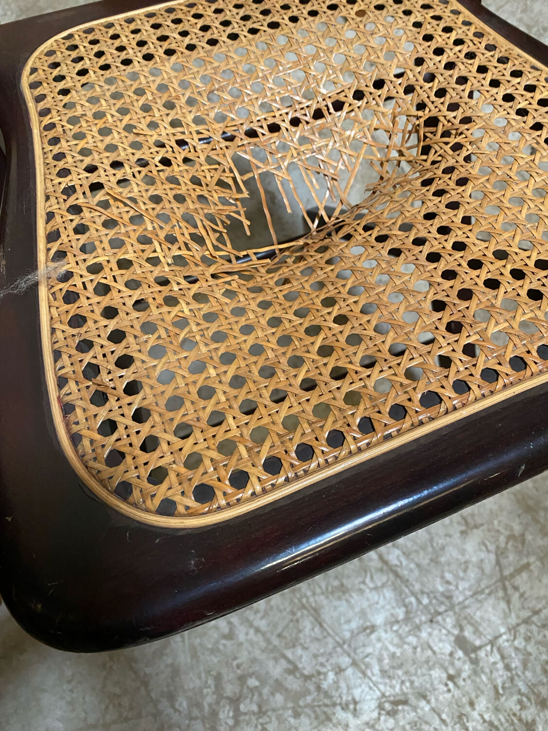 4 cane-seated solid wood folding chairs to be repaired.