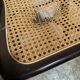 4 cane-seated solid wood folding chairs to be repaired.