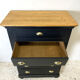 Blackened wooden chiffonnier and varnished top