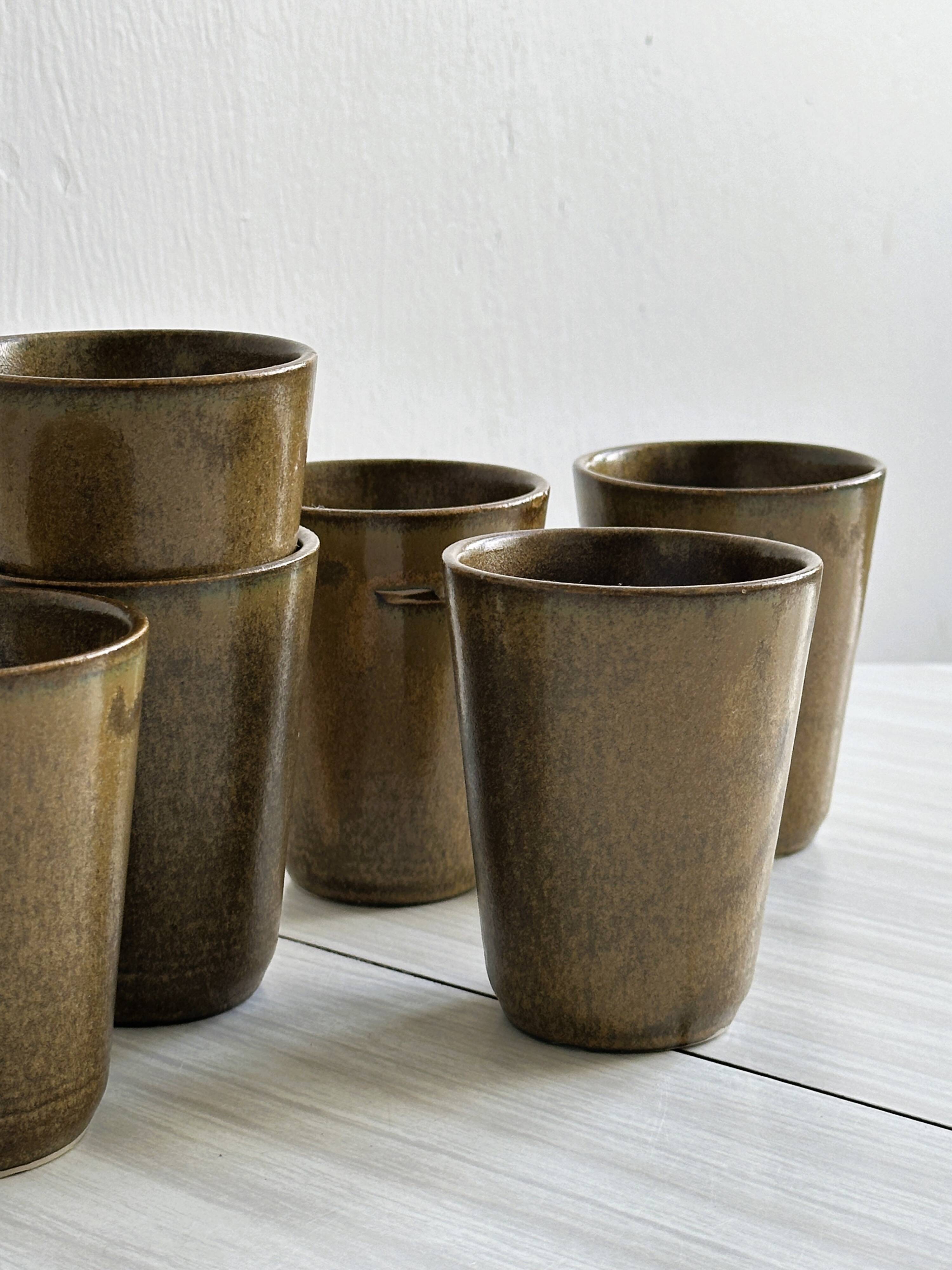6 Digoin ceramic mugs.