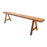 Rustic solid wood farmhouse bench with trestle legs - 1960s