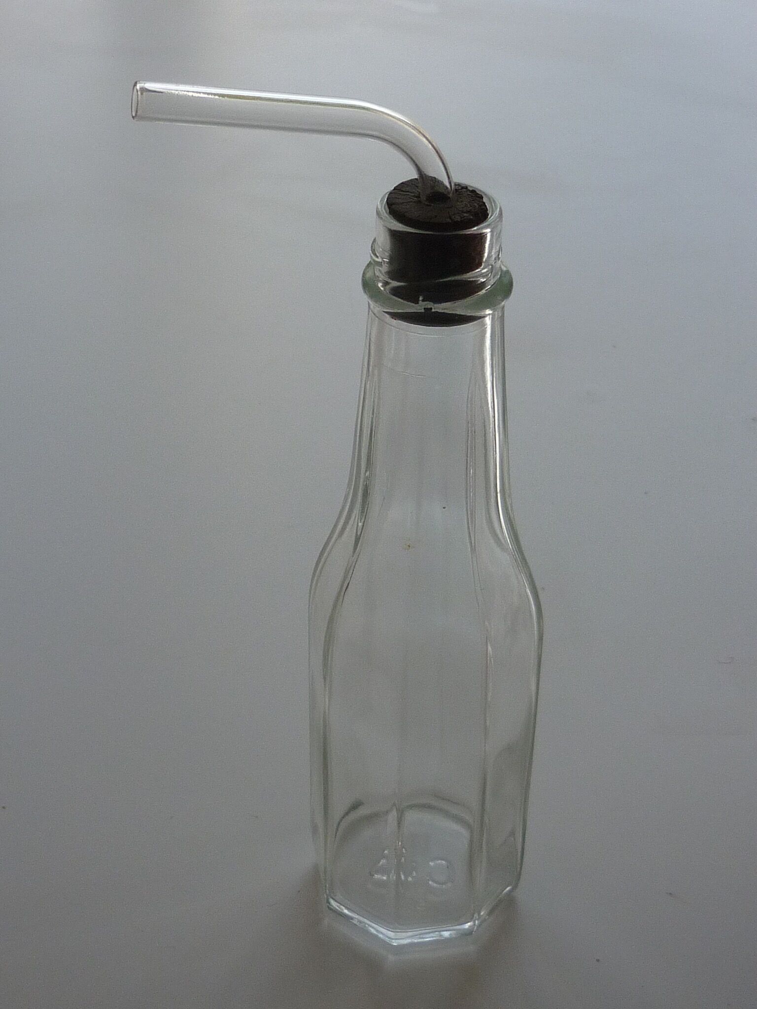 Old bottle with glass pipette