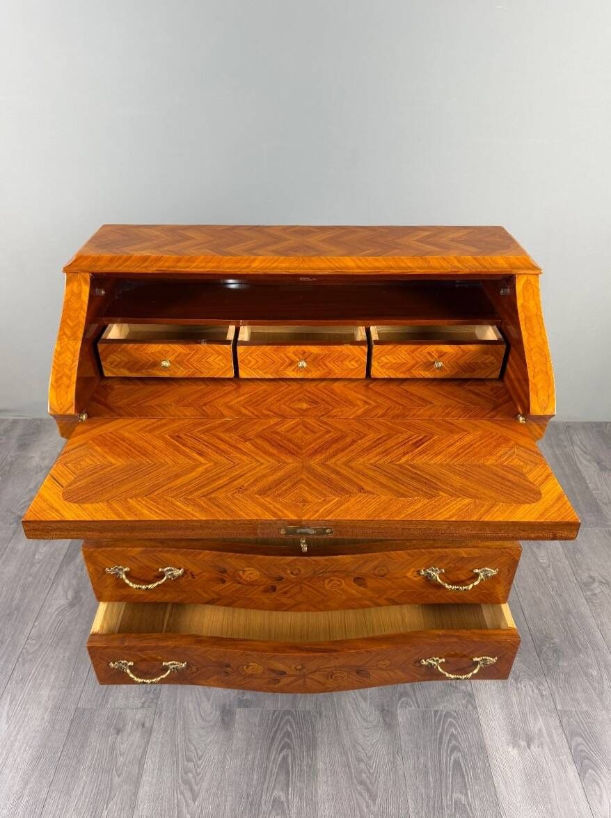 Louis XV style writing desk with a drop-leaf, made of veneer and marquetry, 19th century.
