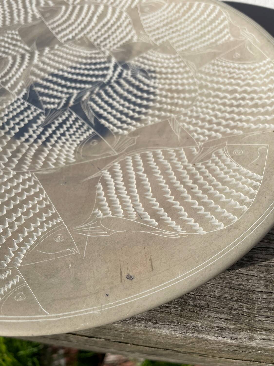 Ethnic handmade round fish dish