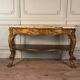Golden wooden console, four legs adorned with sea monsters, purple breccia marble, around 1900.