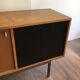 Sideboard with double sliding doors and bar on a metal base