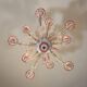 Venetian Rezzonico chandelier in colourless and red Murano glass, circa 1900.