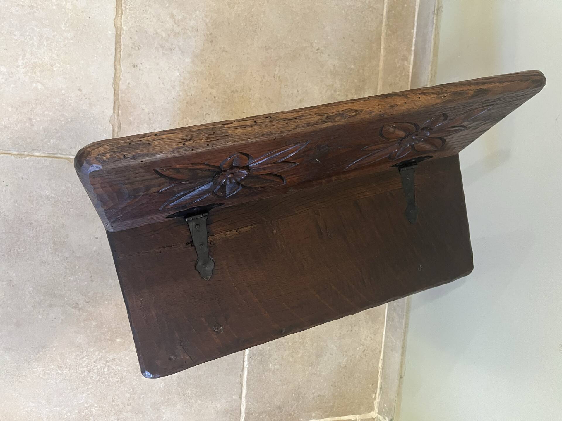 Small antique wooden bench with a folding backrest.