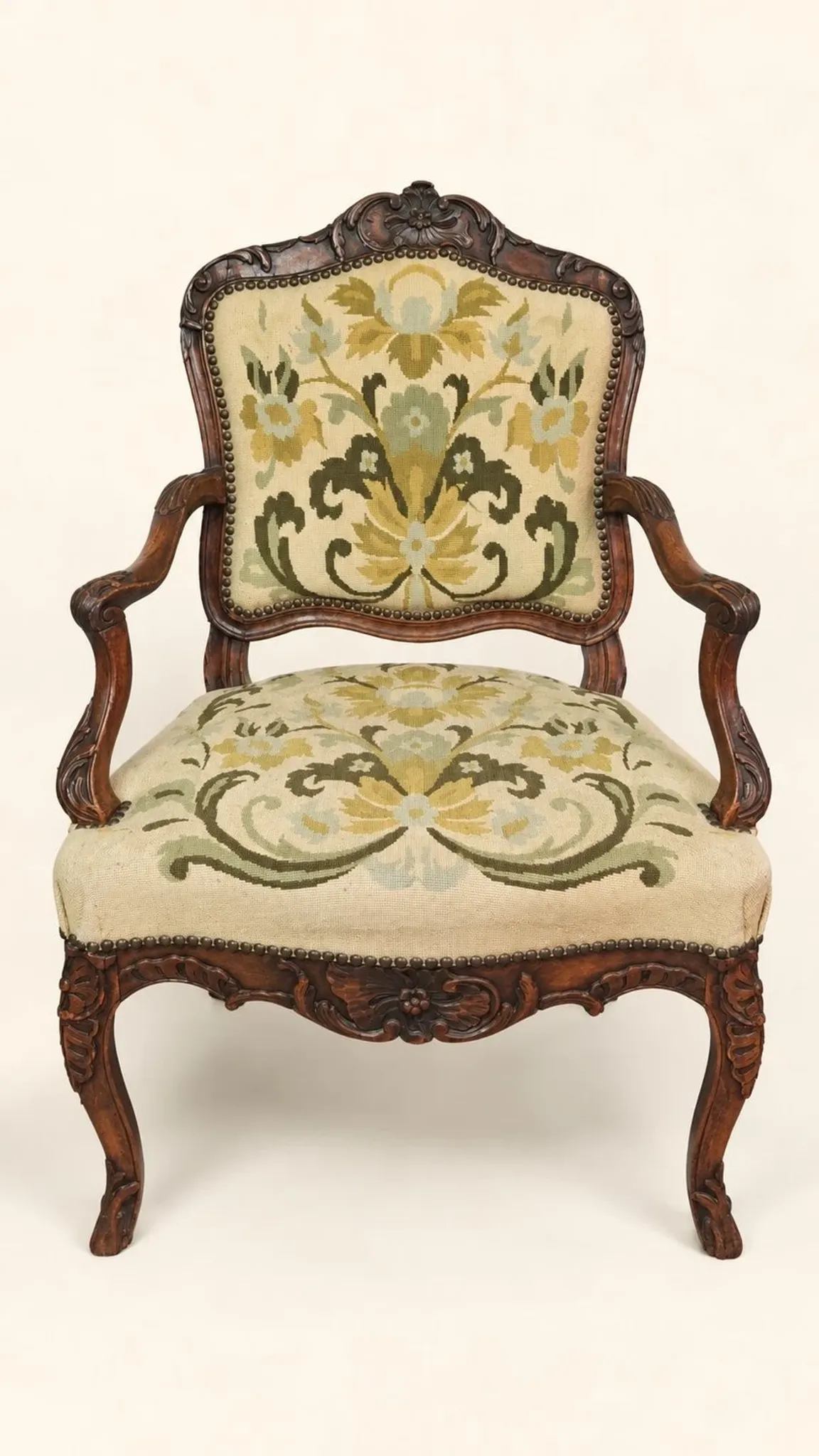 Louis XV cabriolet armchair, carved walnut, petit point tapestry, 18th century.
