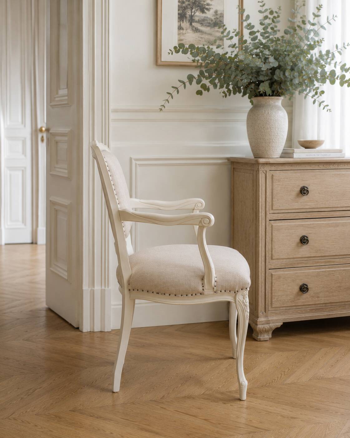 Louis XV style armchair in patinated beige, upholstered in beige fabric.