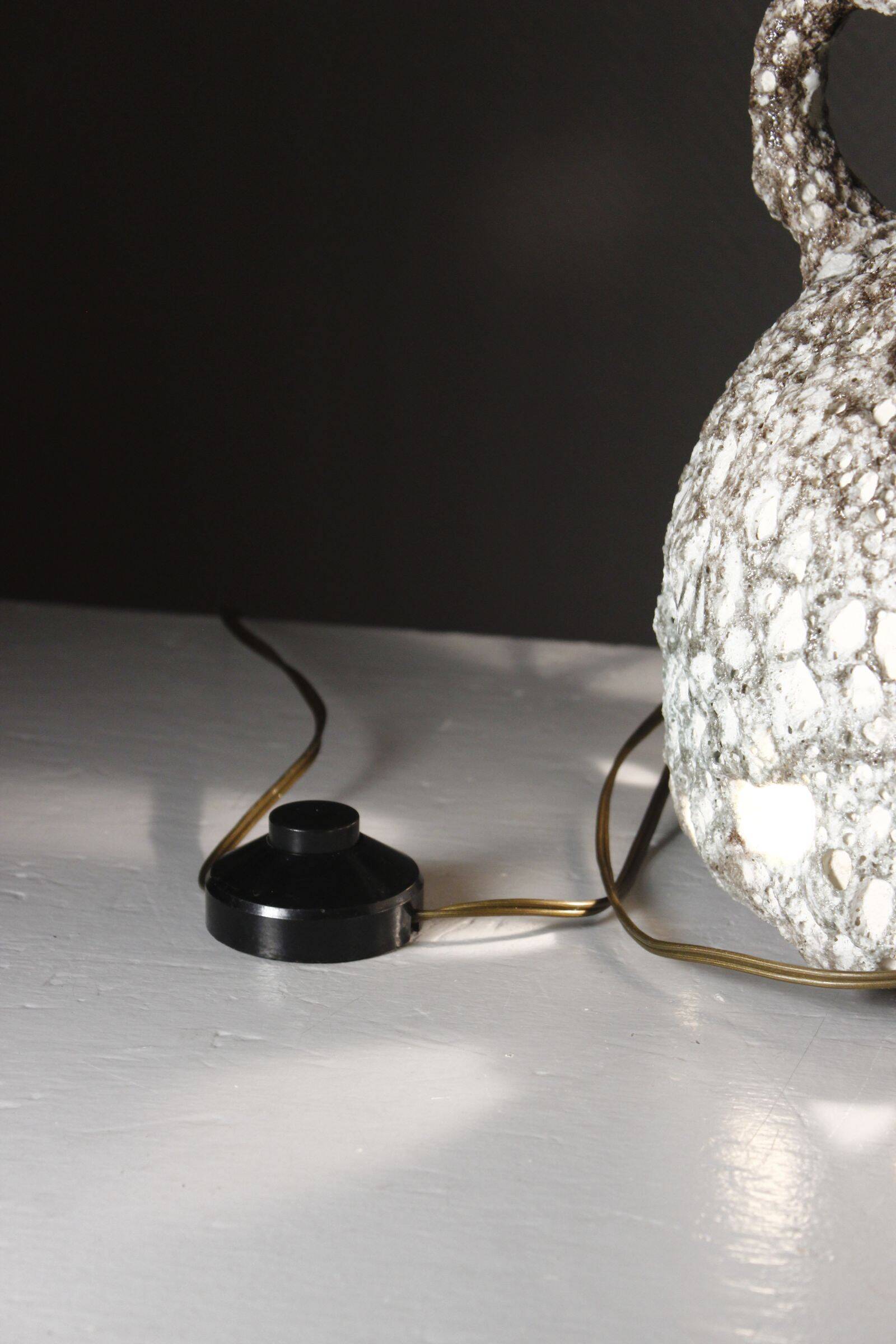 Large ceramic lamp base, fat lava, brutalist design, double lighting.
