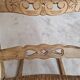 Oak rocking chair with a straw seat.