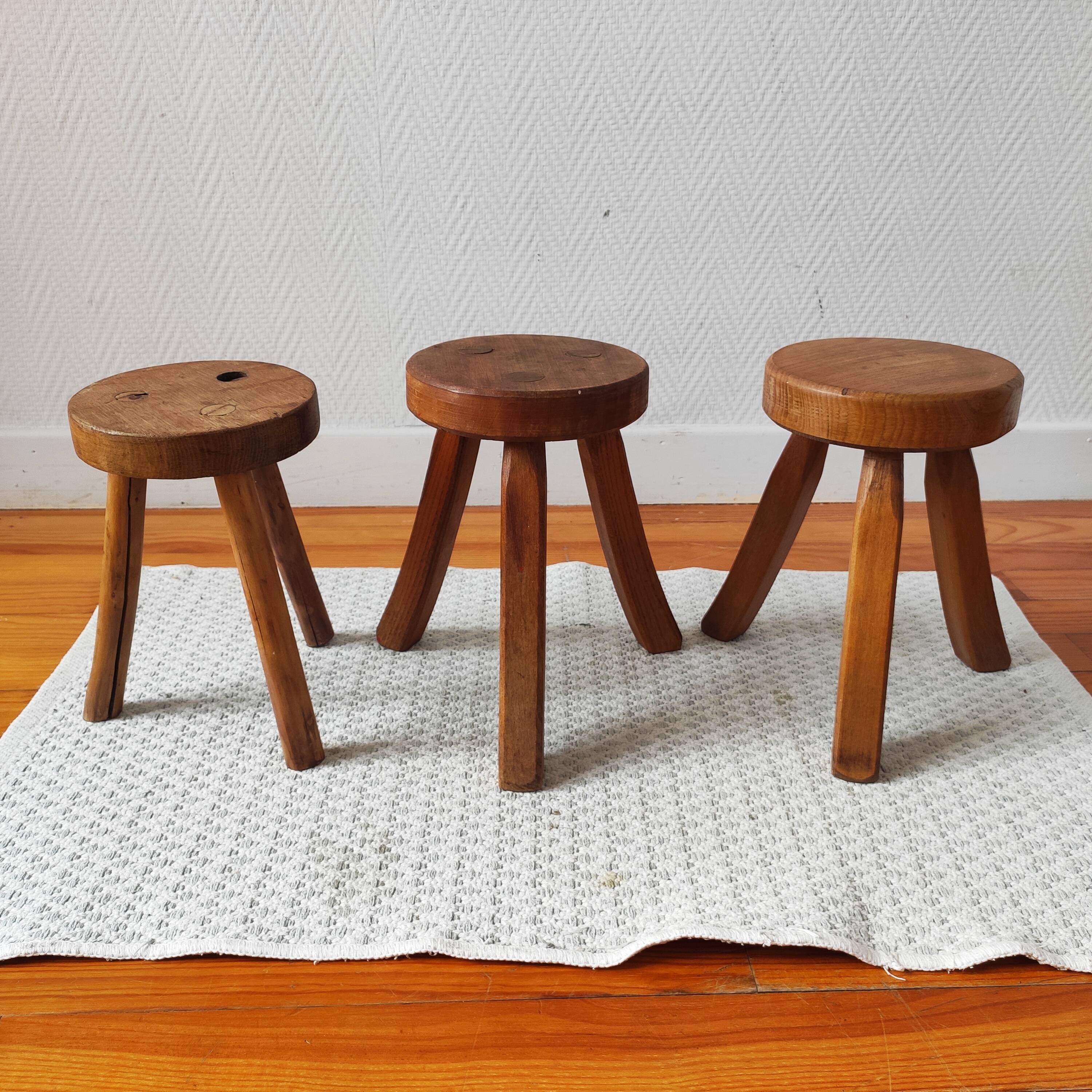 3 wooden tripod stools