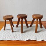 3 wooden tripod stools